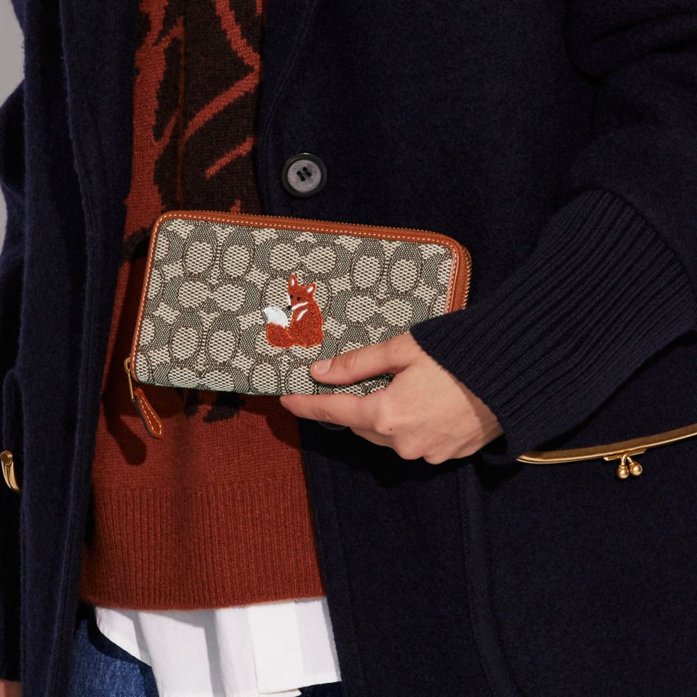 COACH®,Accordion Zip Wallet In Signature Jacquard With Fox Motif,,Detail View