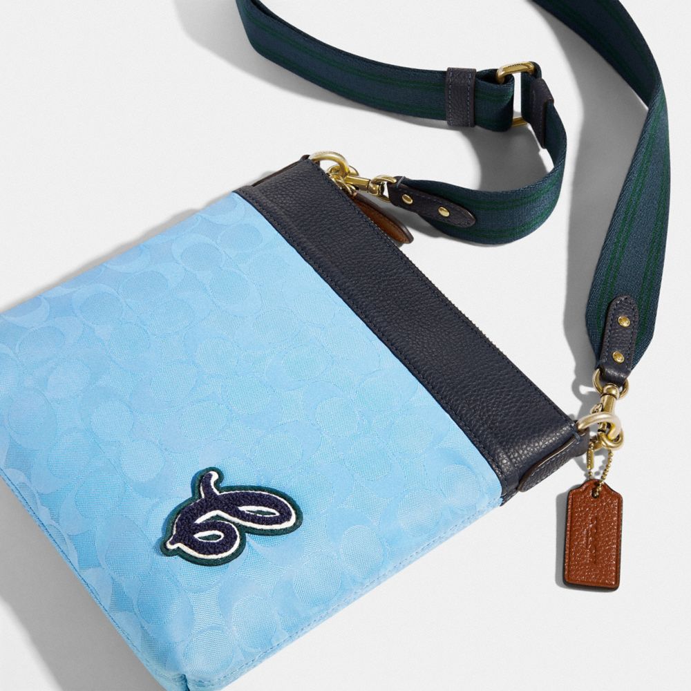COACH®,Kitt Messenger Crossbody Bag In Recycled Signature Nylon,,Closer View