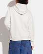 COACH®,80TH ANNIVERSARY HOODIE IN ORGANIC COTTON,cotton,Antique White,Scale View