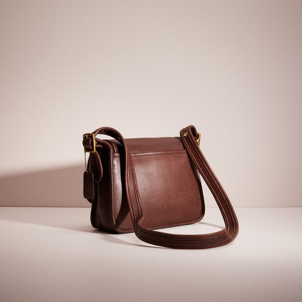 COACH Legacy Leather Mini Saddle Bag in Brown
