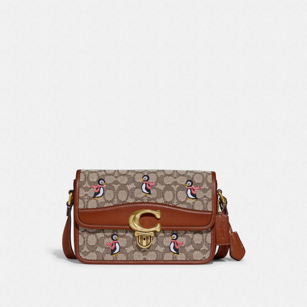 COACH Mickey Crossbody Clutch In Glovetanned Leather in Brown