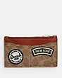 COACH®,ZIP CARD CASE IN SIGNATURE CANVAS WITH PATCHES,Tan/Rust Multi,Front View