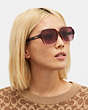 COACH®,SQUARE SUNGLASSES,Transparent Red Gradient,Angle View