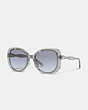 COACH®,EMBEDDED SIGNATURE ROUND SUNGLASSES,Transparent Blue,Front View