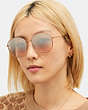 COACH®,METAL ROUND SUNGLASSES,Silver Pink Grad/ Rose Gold,Angle View