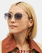 COACH®,METAL ROUND SUNGLASSES,Clear,Angle View