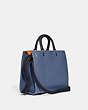 COACH®,ROGUE IN COLORBLOCK,Pebble Leather,Large,Pewter/Washed Chambray Multi,Angle View