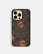 COACH®,IPHONE 13 PRO CASE WITH SIGNATURE CANVAS WITH POP FLORAL PRINT,pvc,Chestnut,Front View
