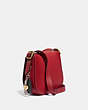 COACH®,UPCRAFTED SADDLE BAG 23 WITH PINS,Smooth Leather,Small,Brass/Washed Red,Angle View