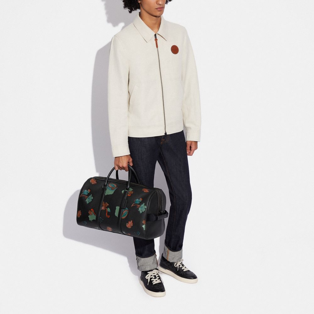 COACH®  Venturer Bag In Signature Canvas With Ski Patches
