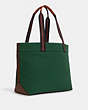COACH®,TOTE BAG 38 IN COLORBLOCK,canvas,X-Large,Black Copper/Kelly Green Dark Saddle,Angle View