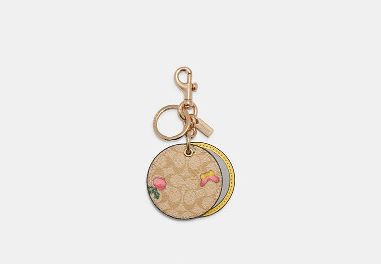 COACH®,MIRROR BAG CHARM IN SIGNATURE CANVAS WITH DREAMY VEGGIE PRINT,Jacquard,Gold/Light Khaki/Pink,Front View