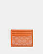 COACH®,SLIM ID CARD CASE IN SIGNATURE JACQUARD,Jacquard,Gunmetal/Candied Orange,Front View