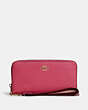 COACH®,LONG ZIP AROUND WALLET,Pebbled Leather,Mini,Gold/Bold Pink,Front View