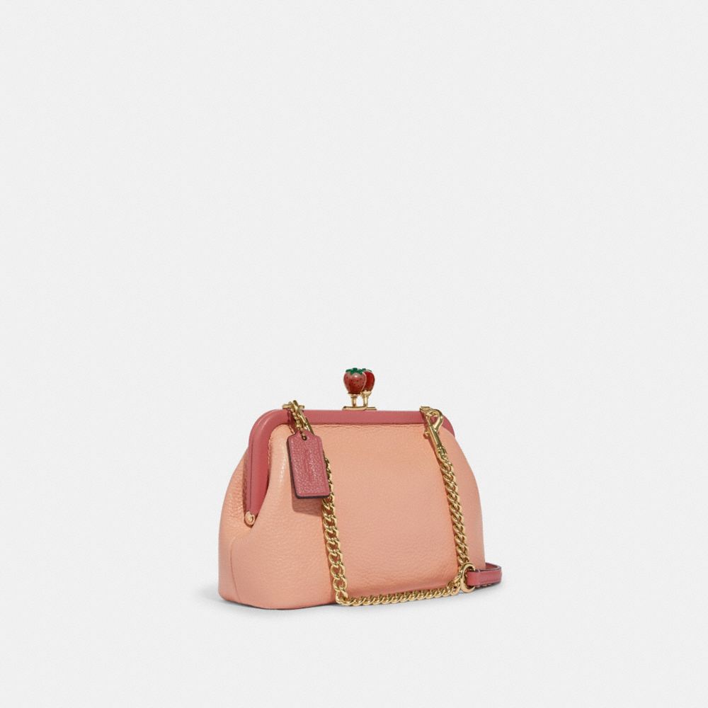 COACH®,NORA KISSLOCK CROSSBODY WITH STRAWBERRY,Gold/Faded Blush/Taffy,Angle View