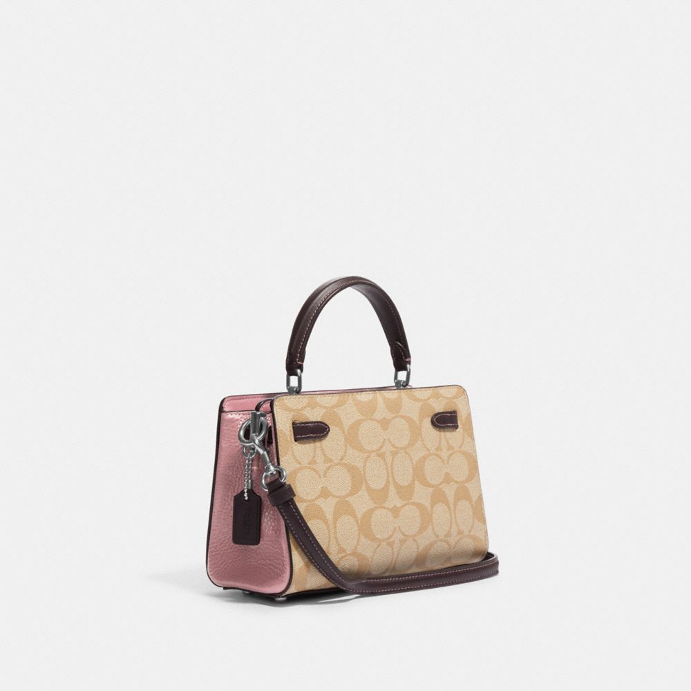 Coach Mini Lane - $285 . Signature coated canvas, refined pebble