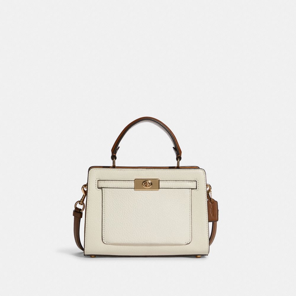 Coach Mini Lane - $285 . Signature coated canvas, refined pebble