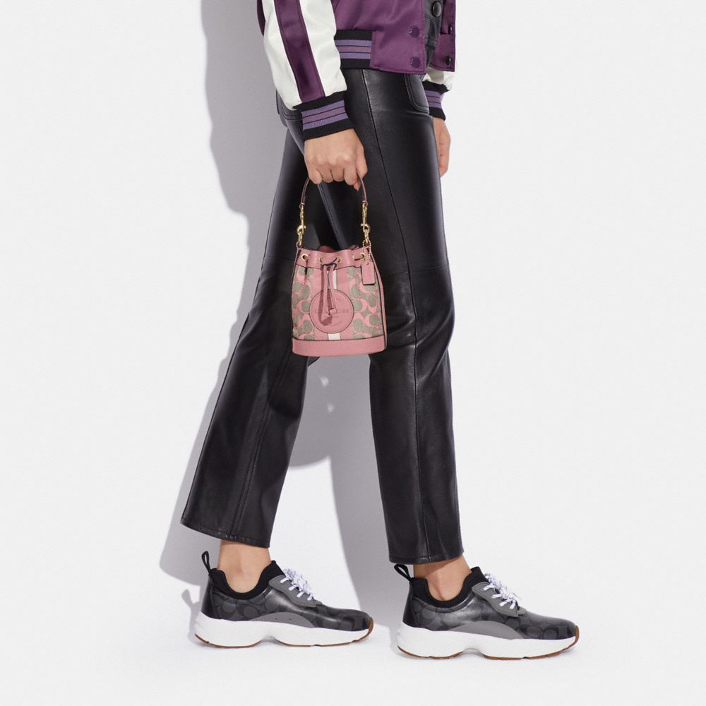 COACH OUTLET®  Mini Dempsey Bucket Bag In Signature Jacquard With Stripe  And Coach Patch