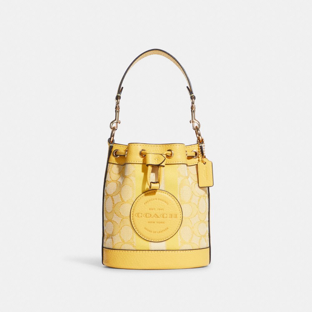 COACH Mini Dempsey Bucket Bag In Signature Jacquard With Stripe And Coach Patch