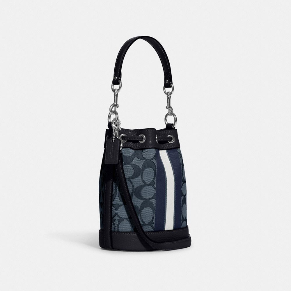 COACH®,MINI DEMPSEY BUCKET BAG IN SIGNATURE JACQUARD WITH STRIPE AND COACH PATCH,Non Leather,Mini,Anniversary,Silver/Denim/Midnight Navy Multi,Angle View