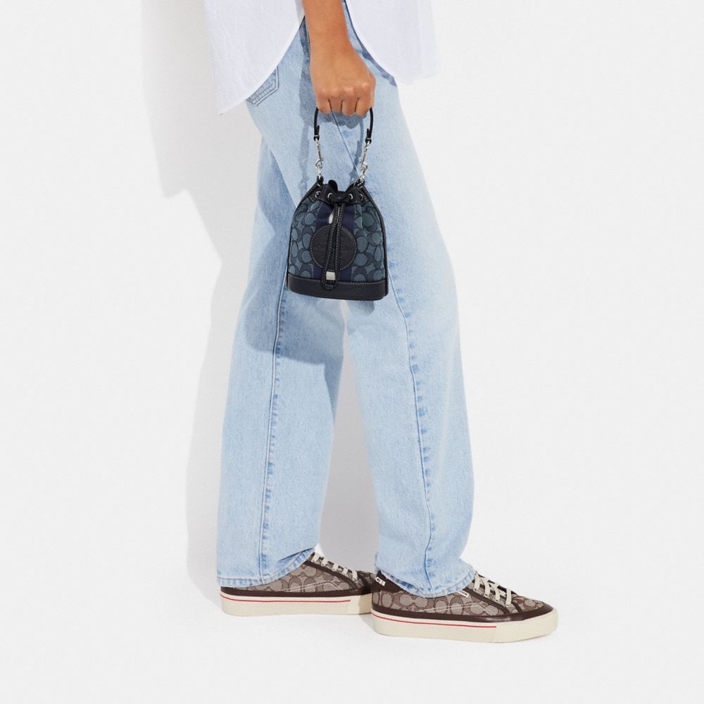 COACH OUTLET®  Mini Dempsey Bucket Bag In Signature Jacquard With Stripe  And Coach Patch