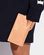 COACH®,SLIM ZIP WALLET,Pebbled Leather,Gold/Faded Blush,Detail View