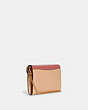 COACH®,TAMMIE CLUTCH CROSSBODY IN COLORBLOCK,Gold/Faded Blush/Taffy,Angle View