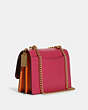 COACH®,KLARE CROSSBODY IN COLORBLOCK SIGNATURE CANVAS,Leather,Medium,Gold/Khaki/Bold Pink Multi,Angle View