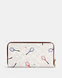 COACH®,LONG ZIP AROUND WALLET IN SIGNATURE CANVAS WITH RACQUET PRINT,Leather,Mini,Gold/Chalk Multi,Interior View
