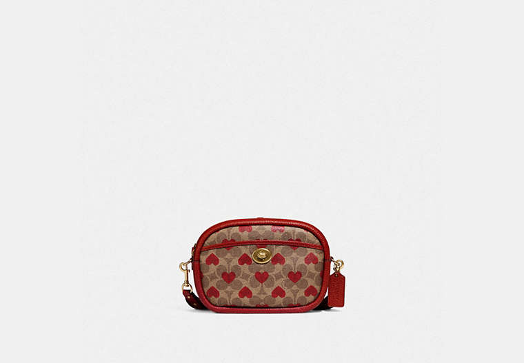 COACH®,CAMERA BAG IN SIGNATURE CANVAS WITH HEART PRINT,Signature Coated Canvas/Pebble Leather,Small,Brass/Tan Red Apple,Front View