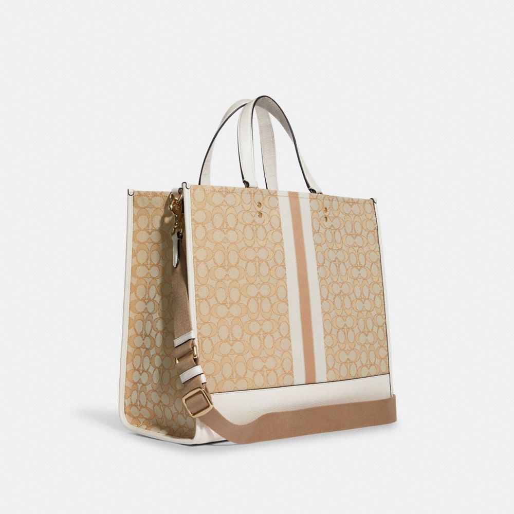 COACH®,DEMPSEY TOTE BAG 40 IN SIGNATURE JACQUARD WITH STRIPE AND COACH PATCH,Non Leather,Large,Office,Gold/Light Khaki Chalk,Angle View