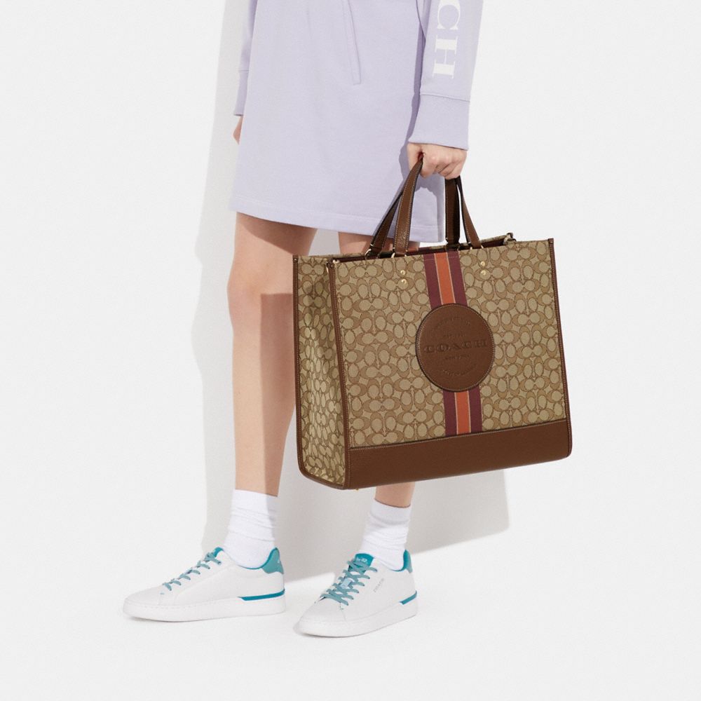 COACH®,Dempsey Tote Bag 40 In Signature Jacquard With Stripe And Coach Patch,,Detail View