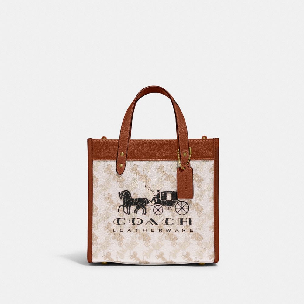 COACH®,FIELD TOTE 22 WITH HORSE AND CARRIAGE PRINT AND CARRIAGE BADGE,Printed Coated Canvas,Medium,Brass/Chalk Burnished Amber,Front View image number 0