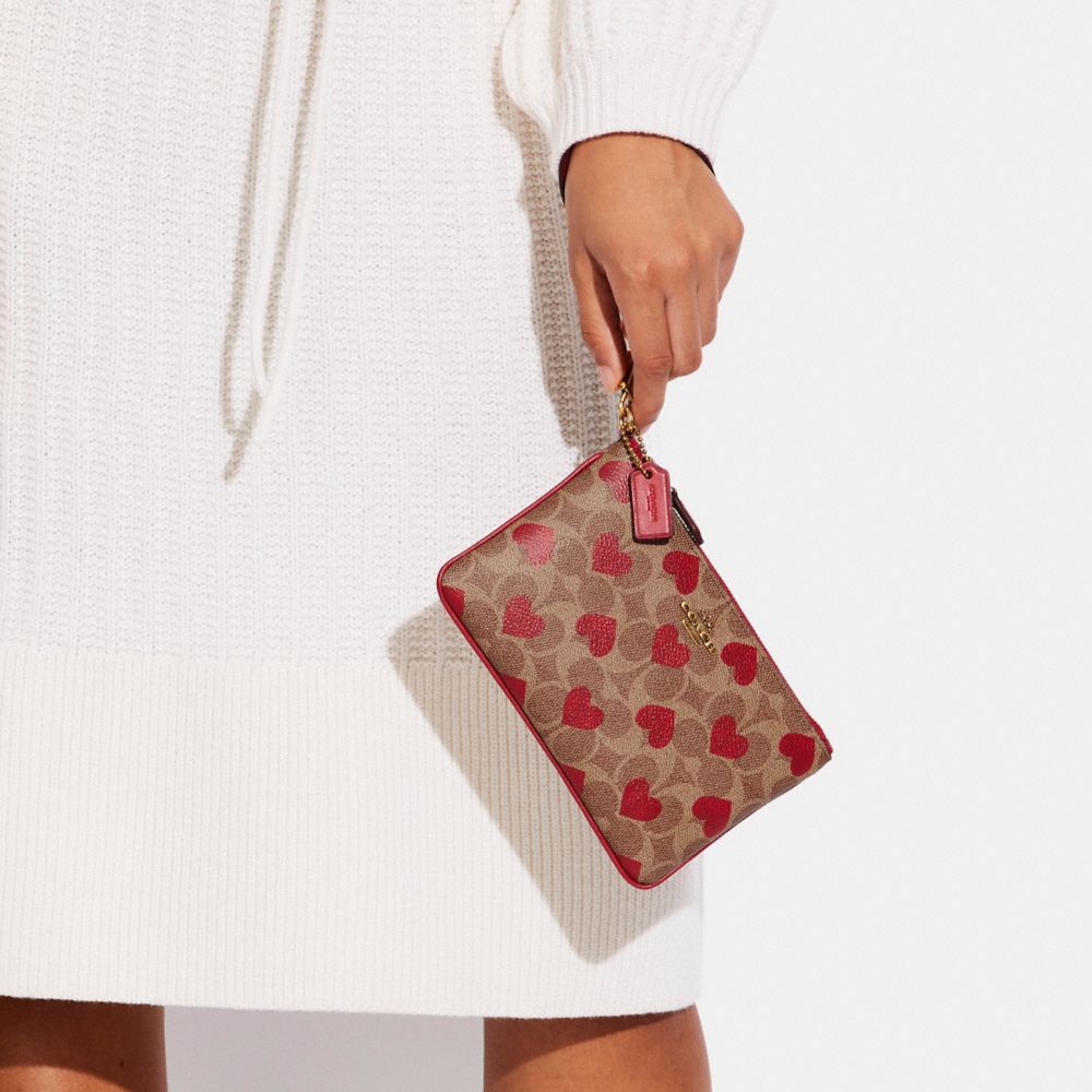 Small Wristlet In Signature Canvas With Heart Print