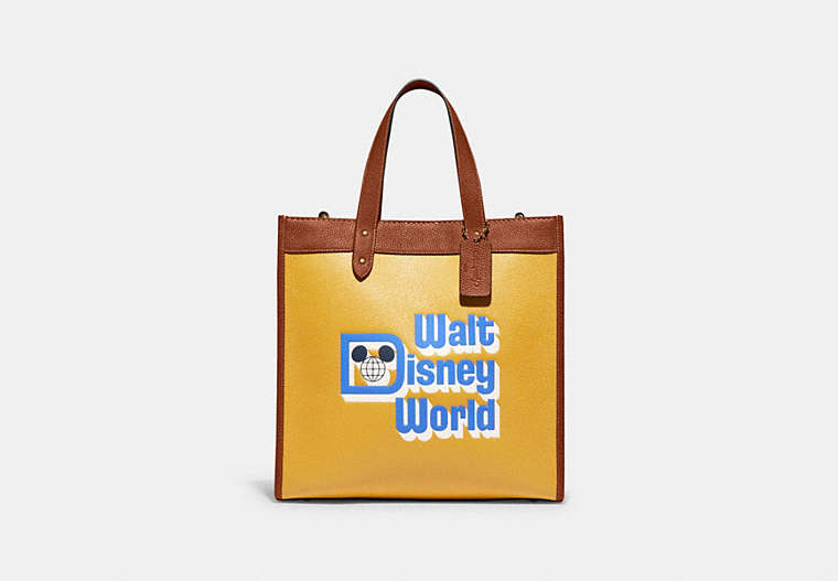 COACH®,DISNEY X COACH FIELD TOTE WITH WALT DISNEY WORLD MOTIF,Refined Pebble Leather,Large,Brass/Honeycomb Multi,Front View