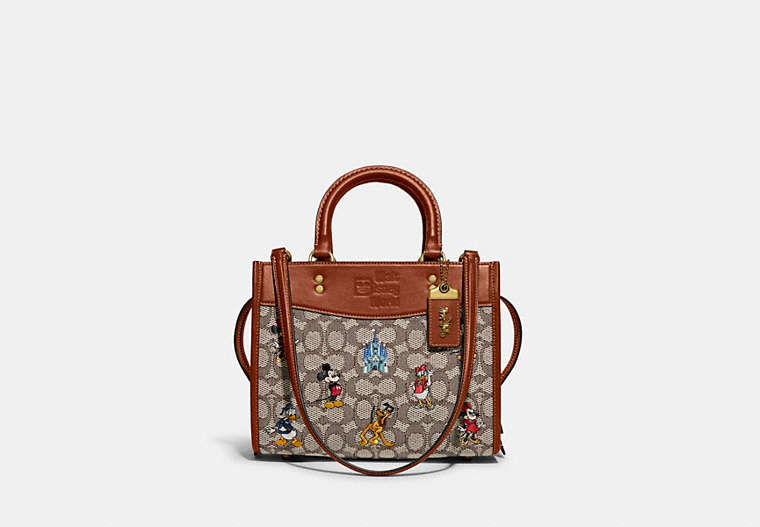 COACH®,DISNEY X COACH ROGUE BAG 25 IN SIGNATURE TEXTILE JACQUARD WITH MICKEY MOUSE AND FRIENDS EMBROIDERY,Signat...,Brass/Cocoa Burnished Amber Multi,Front View