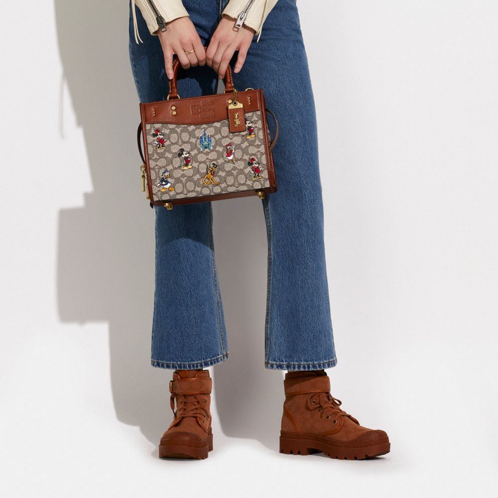 COACH® | Disney X Coach Rogue 25 In Signature Textile Jacquard