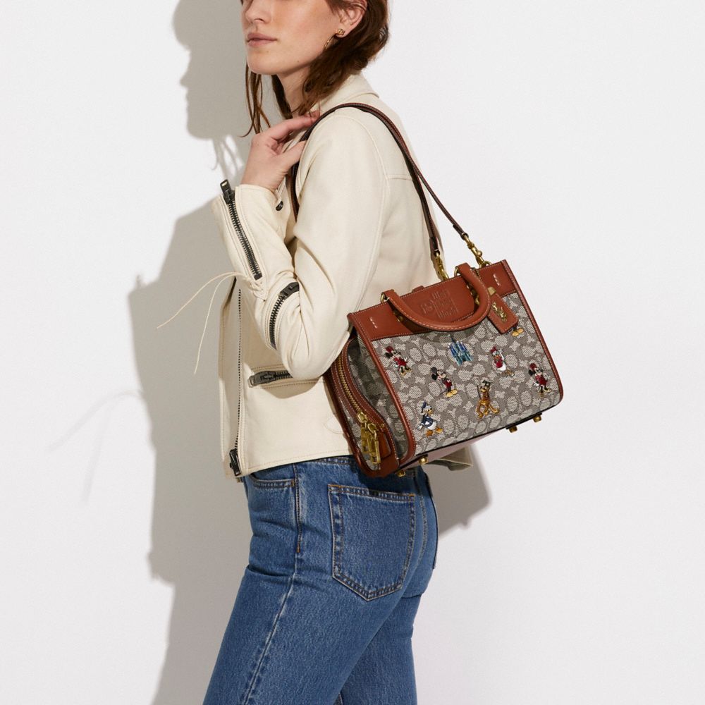 COACH® | Disney X Coach Rogue 25 In Signature Textile