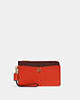 COACH®,L-ZIP WRISTLET IN COLORBLOCK,Pebble Leather,Mini,Brass/Red Orange Multi,Front View