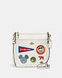 COACH®,DISNEY X COACH KITT MESSENGER CROSSBODY WITH PATCHES,Polished Pebble Leather,Small,Brass/Chalk,Front View