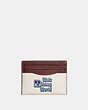 COACH®,DISNEY X COACH CARD CASE WITH WALT DISNEY WORLD MOTIF,Polished Pebble Leather,Mini,Chalk Multi,Front View