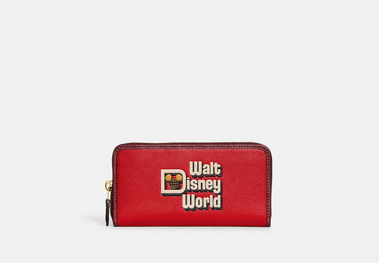 COACH®,DISNEY X COACH ACCORDION ZIP WALLET WITH WALT DISNEY WORLD MOTIF,Polished Pebble Leather,Mini,Brass/Electric Red Multi,Front View