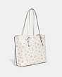COACH®,MOLLIE TOTE IN SIGNATURE CANVAS WITH MYSTICAL FLORAL PRINT,Large,Gold/Chalk Multi,Angle View