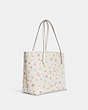 COACH®,CITY TOTE IN SIGNATURE CANVAS WITH MYSTICAL FLORAL PRINT,X-Large,Gold/Chalk Multi,Angle View