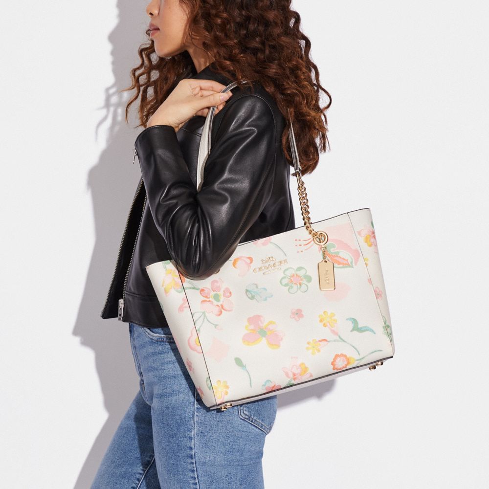 Coach floral print tote on sale bag