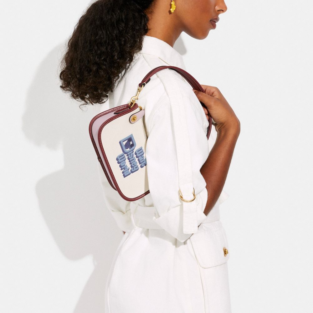 COACH®,Disney X Coach Swinger Bag 20 With Walt Disney World Motif,,Detail View