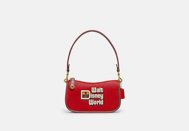 COACH®,DISNEY X COACH SWINGER BAG 20 WITH WALT DISNEY WORLD MOTIF,Glovetanned Leather,Small,Brass/Electric Red Multi,Front View
