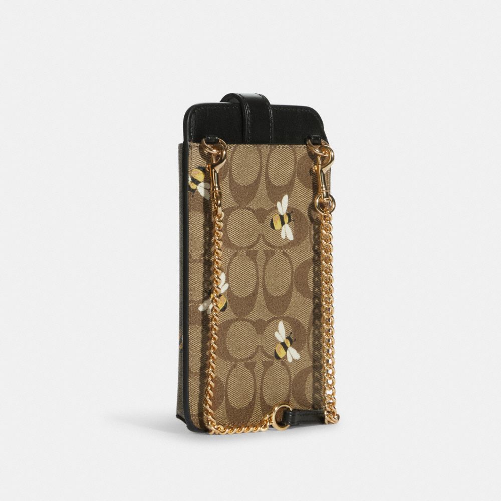 COACH®,Phone Crossbody In Signature Canvas With Bee Print,,Angle View