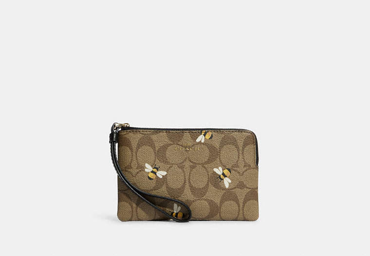 COACH®,CORNER ZIP WRISTLET IN SIGNATURE CANVAS WITH BEE PRINT,Coated Canvas/Leather,Mini,Gold/Khaki Multi,Front View