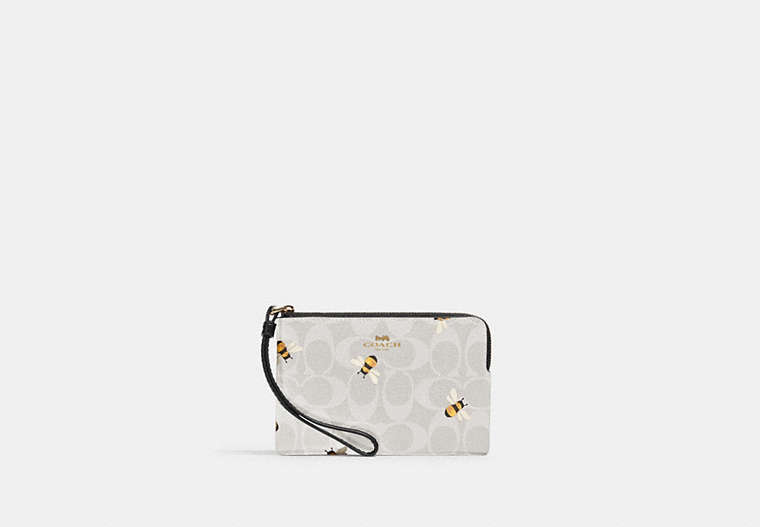 COACH®,CORNER ZIP WRISTLET IN SIGNATURE CANVAS WITH BEE PRINT,Coated Canvas/Leather,Mini,Gold/Chalk/Glacier White Multi,Front View